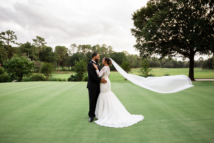bride and groom on the golf course