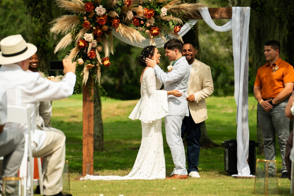 bride and groom at altar