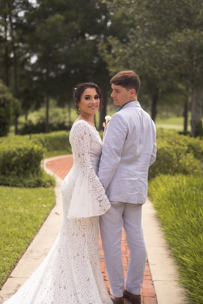 bride and groom on path